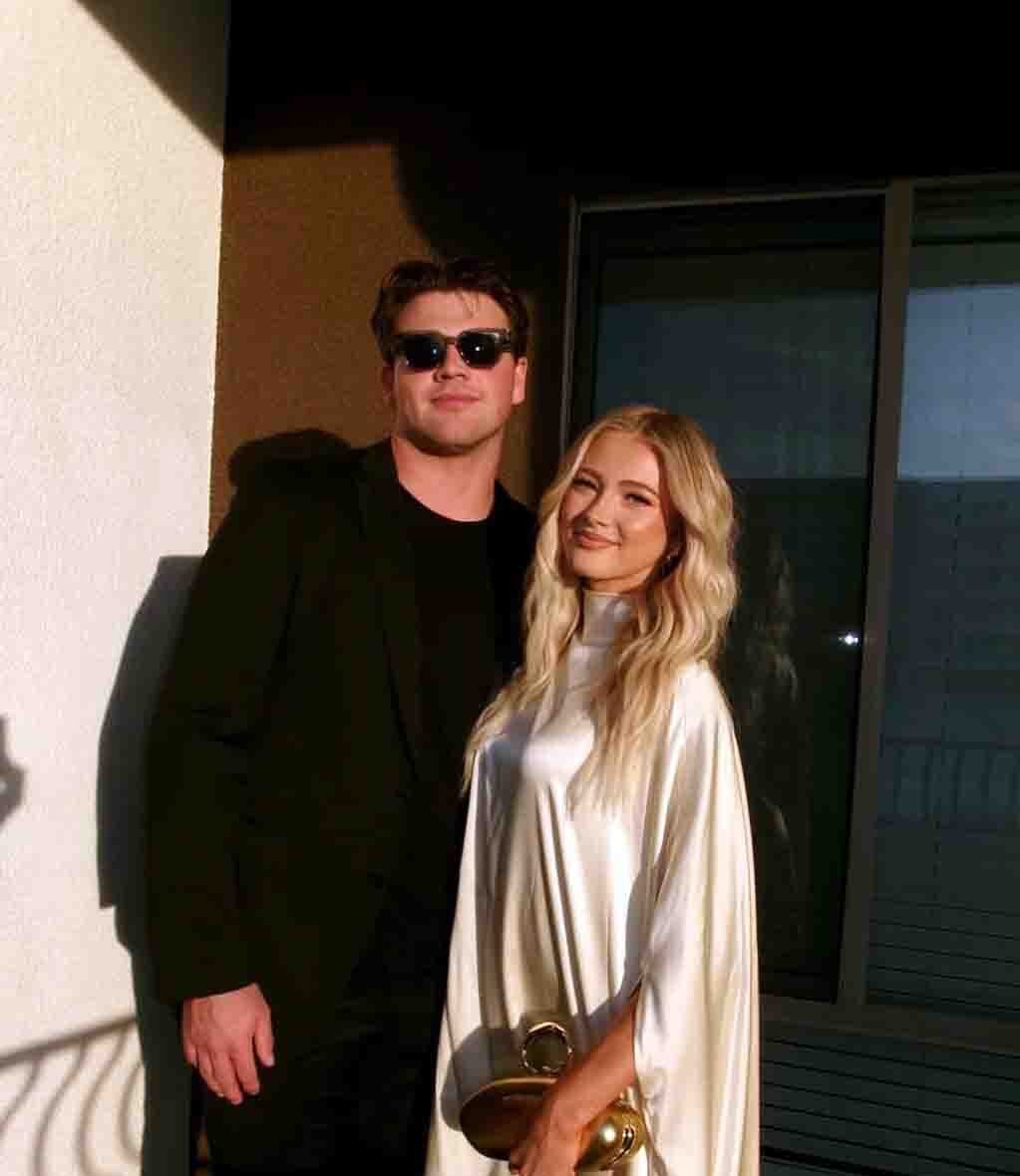 Walker Lyons and girlfriend Rylee Arnold posing together at a 2026 public event.