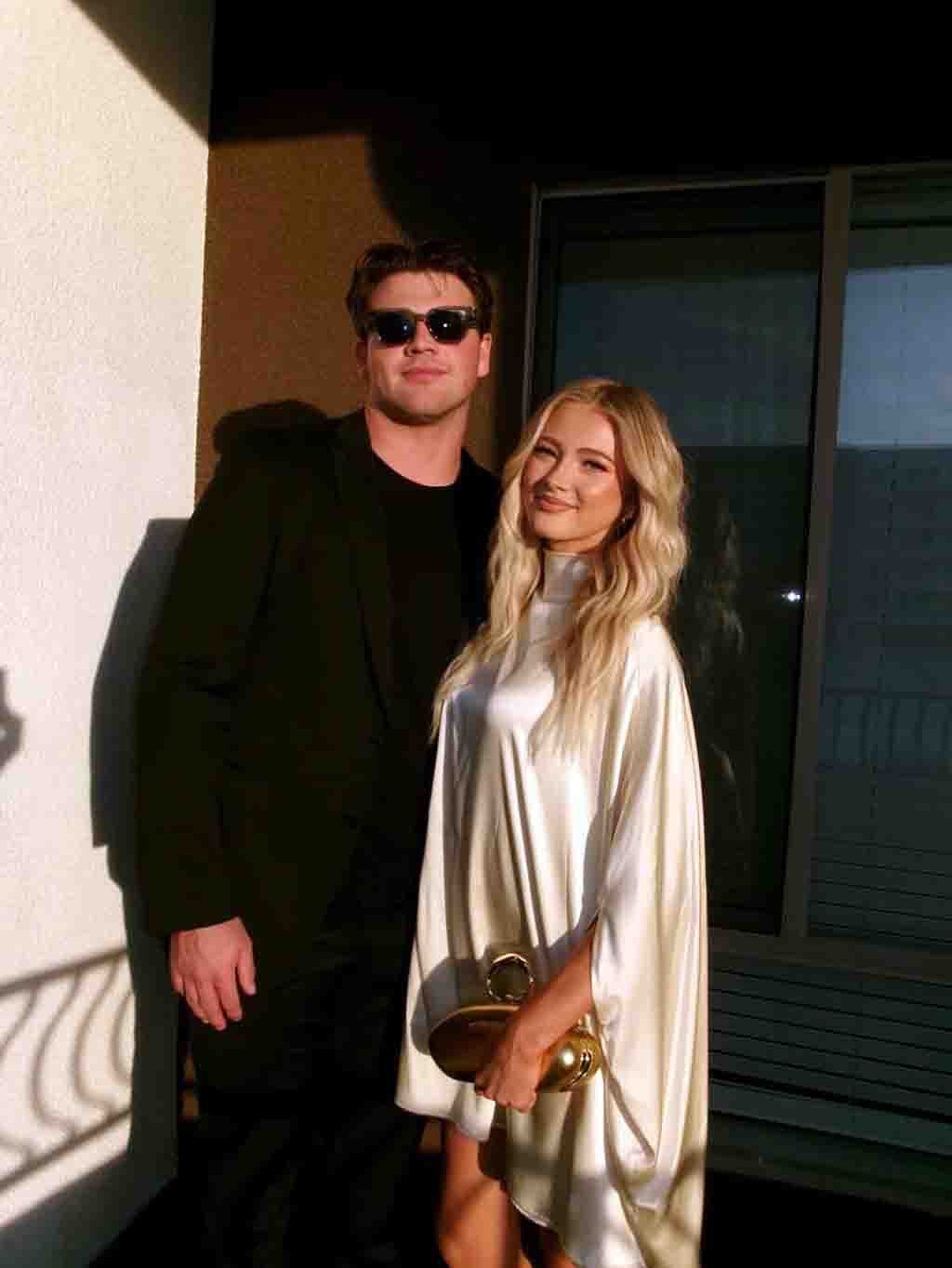 Walker Lyons and girlfriend Rylee Arnold posing together at a 2026 public event.